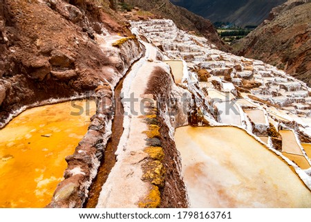 Salt ponds in Maras, Peru. Since pre-Inca times, salt has been obtained in Maras by evaporating salty water from a local subterranean stream.