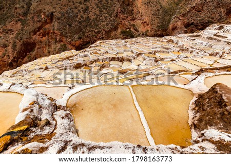 Salt ponds in Maras, Peru. Since pre-Inca times, salt has been obtained in Maras by evaporating salty water from a local subterranean stream.