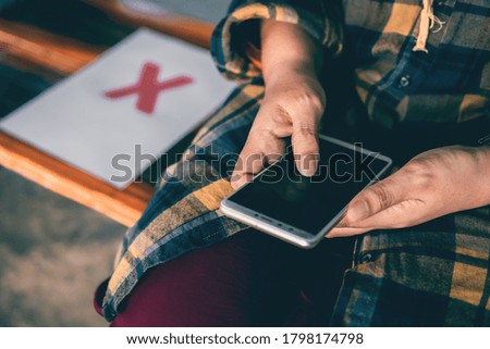 Young woman using smartphone searching for attractions on holiday. and social distancing concept