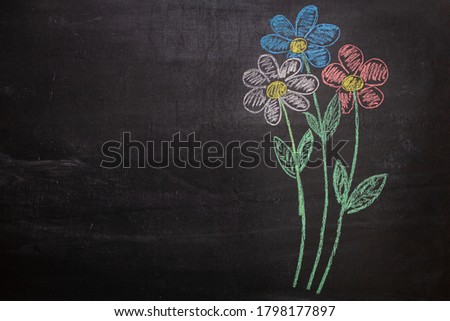 Drawing of a bouquet of flowers on a chalk Board Royalty-Free Stock Photo #1798177897