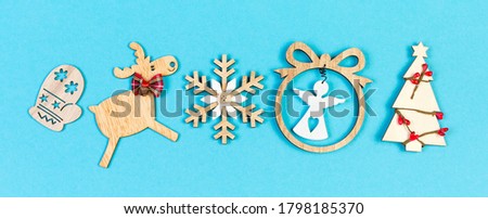 Banner top view of holiday ornament made of Christmas decorations on colorful background. New Year time concept with copy space.
