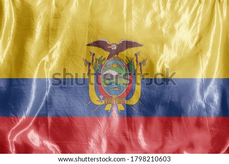 State flag fluttering in the wind. Colored background on textiles
