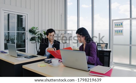 Employees working normal in office room.