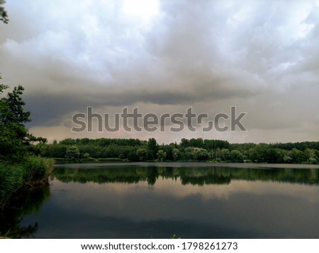 Clouds under the dark lake