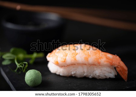 shrimp sushi on black board, close up