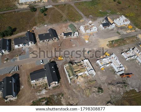 New private housing development construction in rural countryside aerial view. Drone photo.