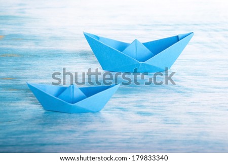 Two Origami Boats in the Sea