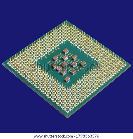 Photo of a CPU chip isolated on a blue background . Microprocessor, Central processing unit. Computer and nanotechnologies, development of Microtechnologies.