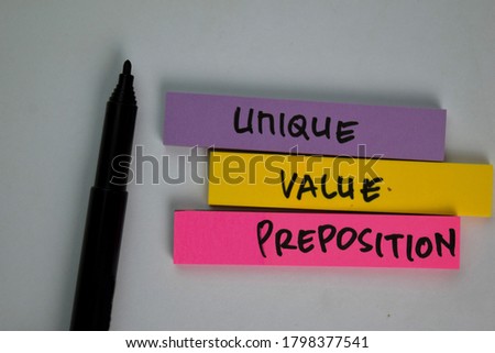 Unique Value Proposition - UVP text on sticky notes isolated on office desk