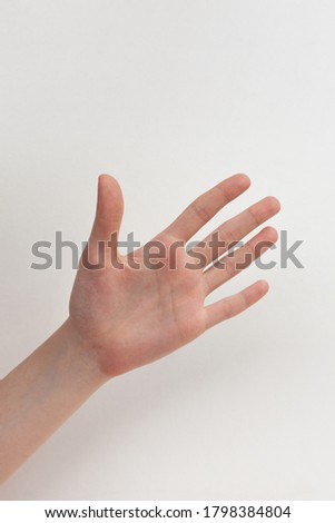 A human hand on a white background shows the sign of Spock from star wars. Welcome sign