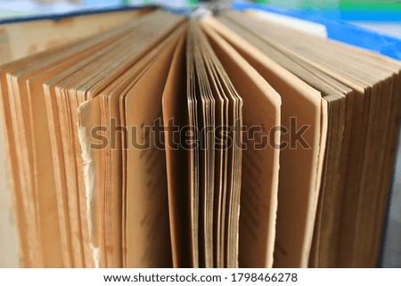 A close up of old books opened selective focus and shallow depth of field