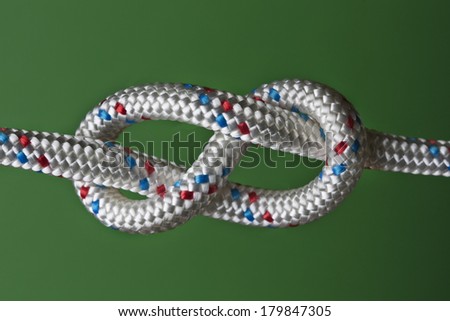 eight rope knot isolated on green