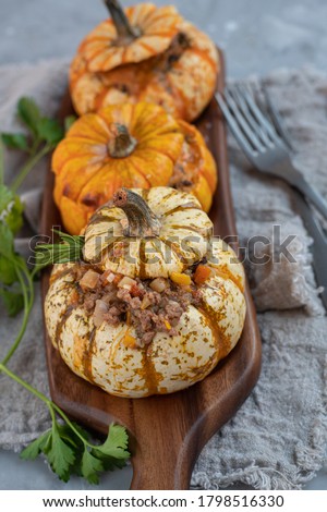 A Group of Mini Pumpkins stuffed with meat and mushrooms in bechamel sauce.