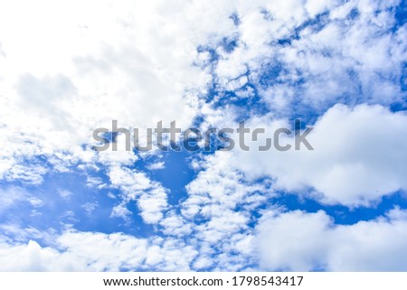 Blurred photography of a lot of fluffy cloud in the blue sky. Beautiful cumulus and altocumulus clouds in the sky in the afternoon. Skyscape and cloudscape in summer afternoon. Natural sky background.