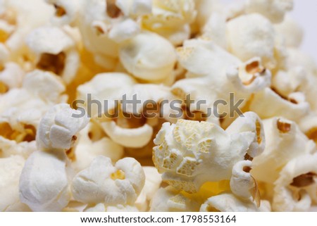lots of yummy popcorn on white background