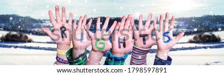 Children Hands Building Word Rights, Snowy Winter Background