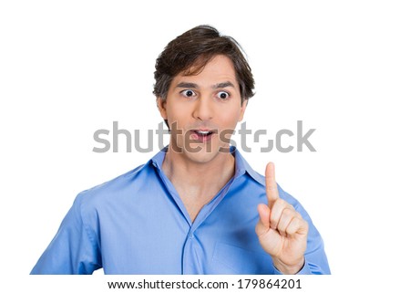 Closeup portrait of young man pointing up with index finger, looking energetic, showing he got idea, isolated on white background. Positive human emotions, facial expressions, feelings, symbols, signs