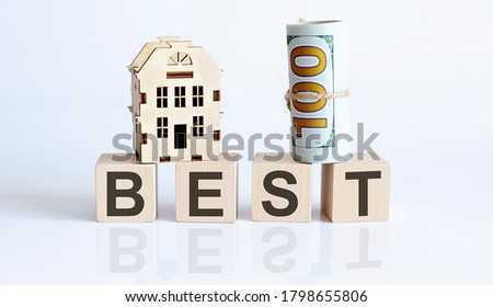 Wooden blocks with the word For BEST Real estate concept. Rent apartment. Property.