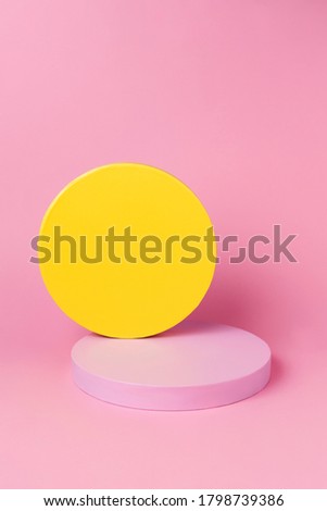 Abstract geometry shape pink and yellow color podium on pink color background for product. Minimal contemporary concept.