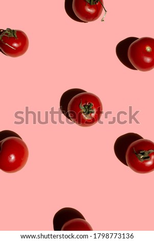 Tomato pattern isolated on pastel pink background.	