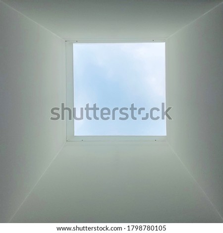 Hatch in the ceiling, looking above there is day light and sky