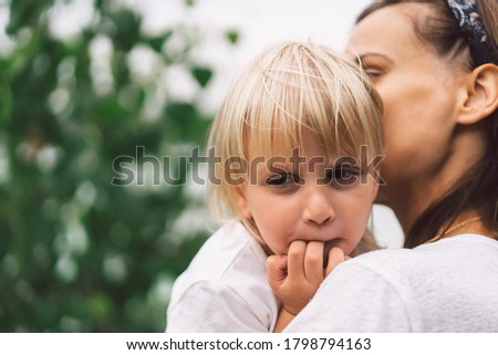 Young mother holding her baby. Mother and  little daughter  having good time in the nature. Mothers Day. Family Concept