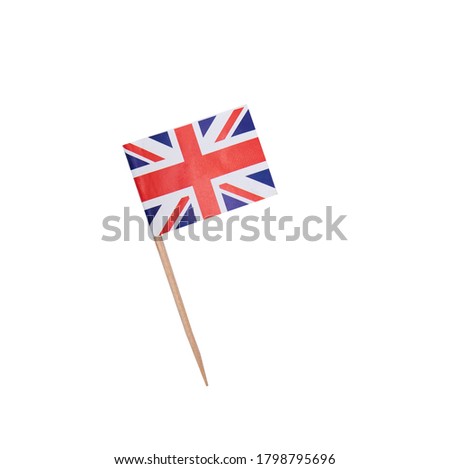 Tooth pick wit a paper flag of the United Kingdom, UK flag on a wooden toothpick