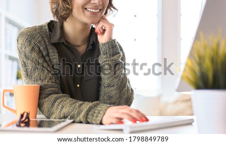 Young woman looking in laptop display watching training course