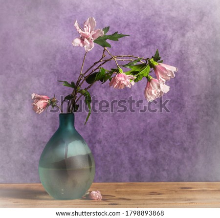 pink field flowers bouquetover purple rustic background