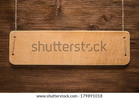Signboard on wooden background  