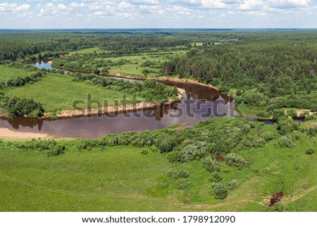 Forest river from a height in the taiga