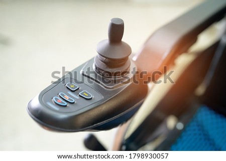 Electric wheelchair for old elder patient cannot walk use in home or hospital, healthy strong medical concept. Royalty-Free Stock Photo #1798930057