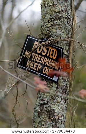 No trespassing sign on tree