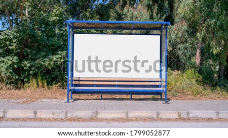 empty bus stop in blue metal frame with white blank billboard mock-up front view