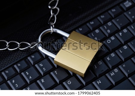 golden padlock on a black laptop keyboard. internet security concept. antivirus software concept. electronic wallet symbol.