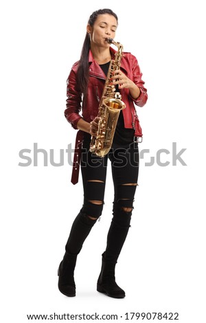 Full length portrait of a female saxophonist in a red leather jacket playing a sax isolated on white background Royalty-Free Stock Photo #1799078422