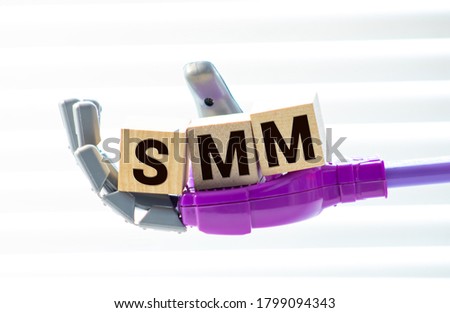 SMM - social media marketing - letter pices on the wood.