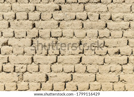 Wall and adobe clay brick as background