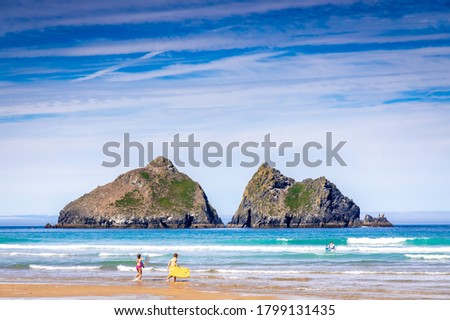 Gull rocks on sunny day in Hollywell Bay in Cornwall, UK Royalty-Free Stock Photo #1799131435