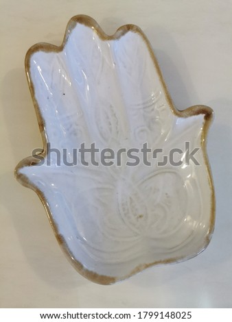 Plate in shape of a hand.