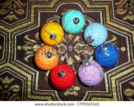 Multi-colored knit balls decor on the Christmas tree