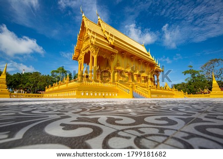 Temple gold color beautiful art  architecture in at Wat Pluak Ket  rayong,Thailand