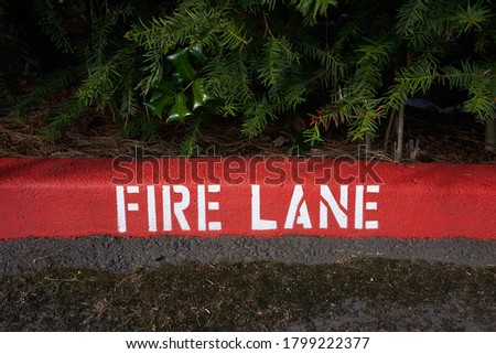 Painted fire lane curb markings.