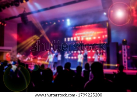 Picture blur effect.Worship God on Sunday with joy.Concert in low light and lens flare.