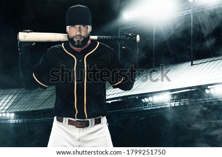 Porfessional baseball player with bat on grand arena. Ballplayer on stadium.