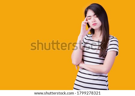 Asian women implementing thoughts on a yellow background.
