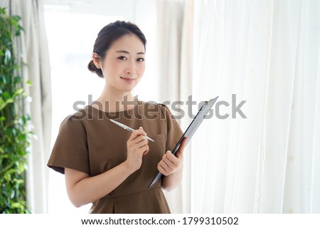 Japanese woman working at an aesthetic salon Royalty-Free Stock Photo #1799310502
