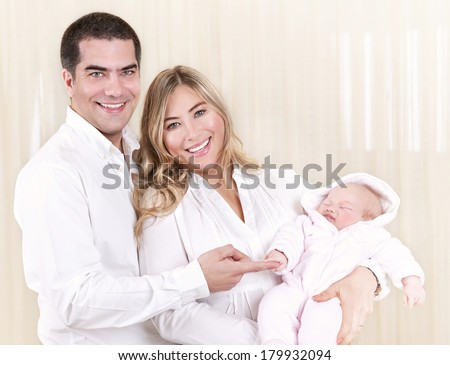 Cheerful young family with cute newborn baby isolated on white background, new life, happy parenthood, purity and tenderness concept