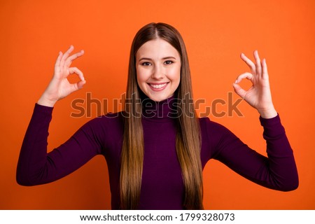 Photo of positive cheerful girl show okay sign enjoy great excellent ads promotion wear purple winter lifestyle sweater isolated over bright shine color background