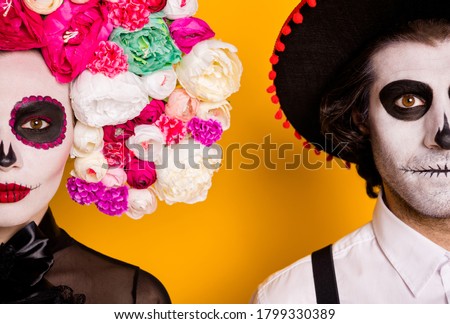 Cropped closeup headshot photo of scary couple man lady half-face mysterious concept wear black dress death costume rose headband suspender sombrero isolated yellow color background